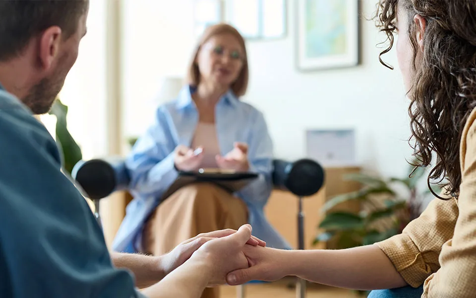 Counselor Guiding Patient Through Alcohol Detox Therapy.
