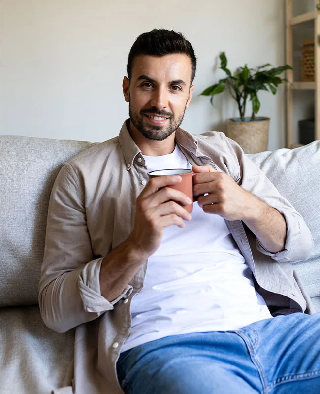Calm Morning Scene Of A Man With A Mug At A Luxury Drug Rehabilitation Center.