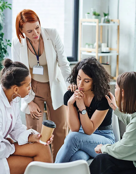 Individuals Engaging In Group Therapy And Sharing Stories At A Licensed Detox Center